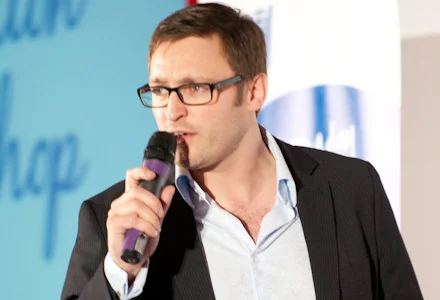 Paul Chapman speaking into a microphone.
