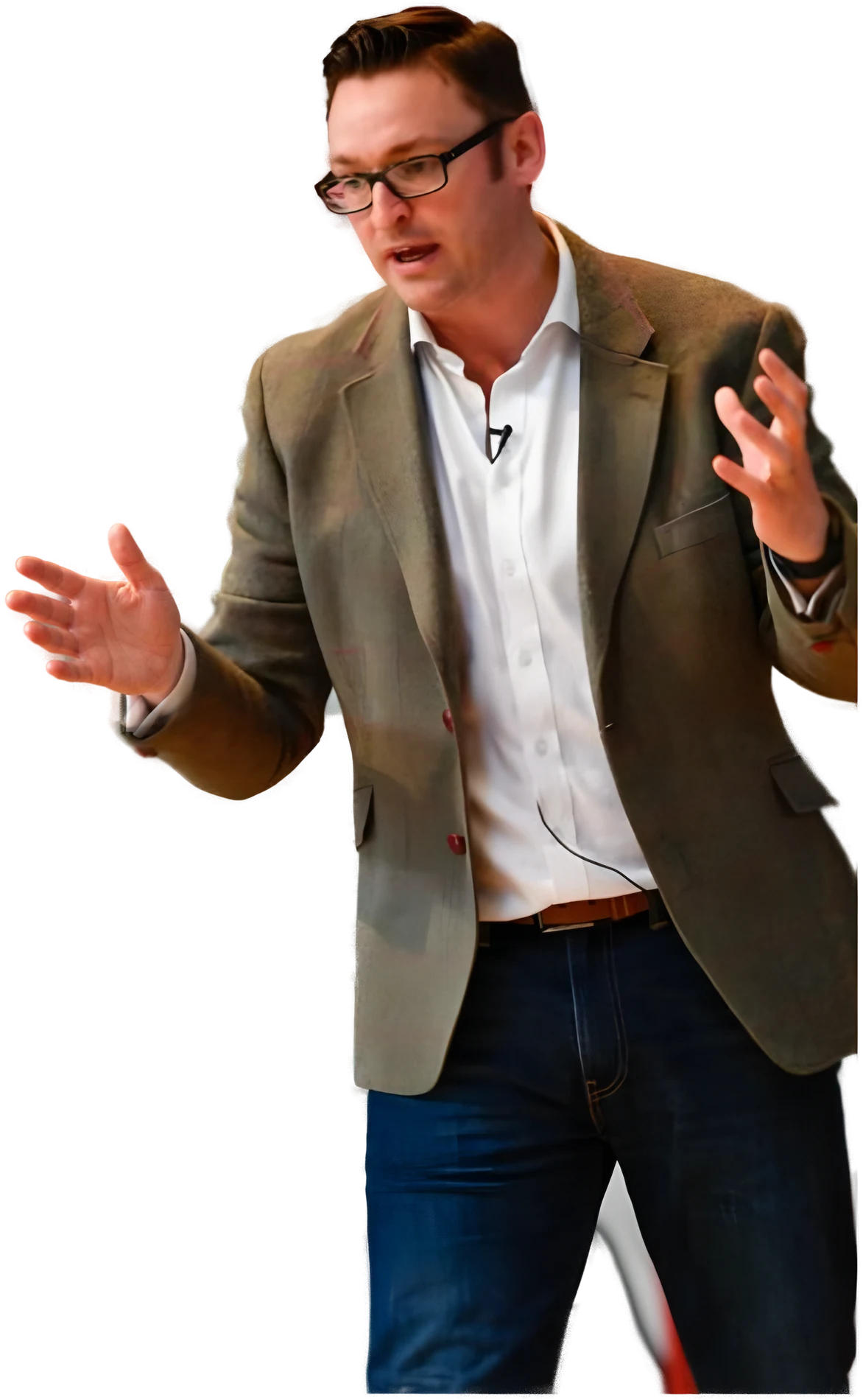 Paul Chapman on stage in a tweed jacket, mid-sentence.
